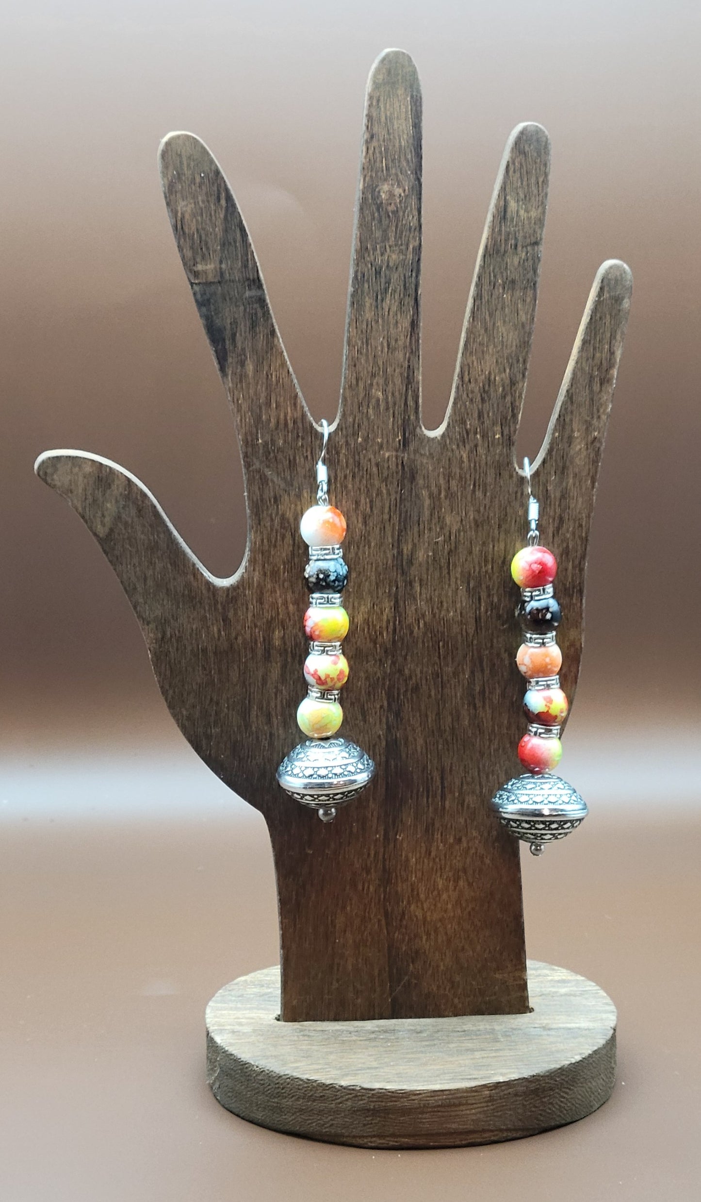 Red, yellow, and black long beaded earrings